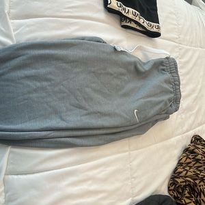 Nike dri fit grey sweats with zipper on bottom
